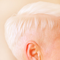 Women's short haircut. Fashionable stylish profile with white short hair. Nice neat back of the head of a girl with a haircut. Hairstyle women.