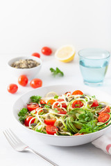 vegan ketogenic spiralized courgette salad with avocado tomato pumpkin seeds