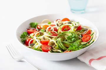 vegan ketogenic spiralized courgette  salad with avocado tomato pumpkin seeds