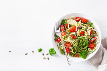 vegan ketogenic spiralized courgette salad with avocado tomato pumpkin seeds