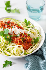 keto paleo zoodles bolognese: zucchini noodles with meat sauce and parmesan