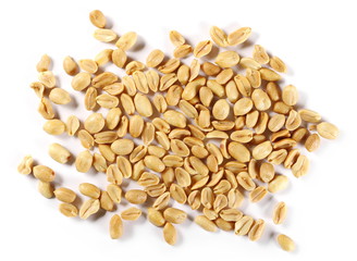 Salted and fried, roasted peanuts, pile isolated on white background, top view