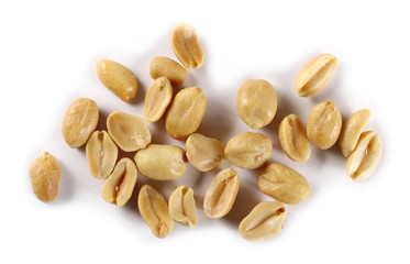 Salted and fried, roasted peanuts, pile isolated on white background, top view