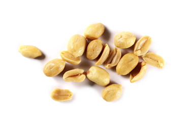 Salted and fried, roasted peanuts, pile isolated on white background, top view
