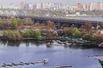 The view of the city. The metal bridge over the river - 251555876
