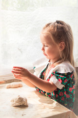  Little girl preparing the dough - 251556027