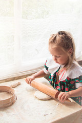  Little girl preparing the dough - 251556056