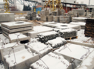 Factory warehouse of reinforced concrete products. Industrial production for the manufacture of building structures.