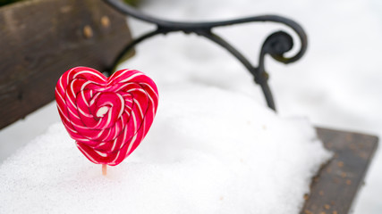 Red heart in the snow