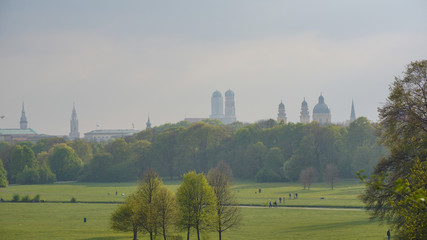 english garden munich bavaria summer park sunset skyline cathedral