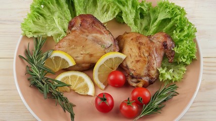 Baked chicken thighs and fresh vegetables garnish