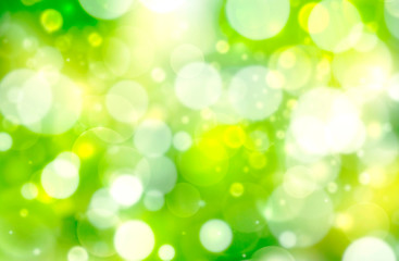 Obraz premium Bright spring bokeh background, blurred, green, yellow and white circles, seasons, summer, spring