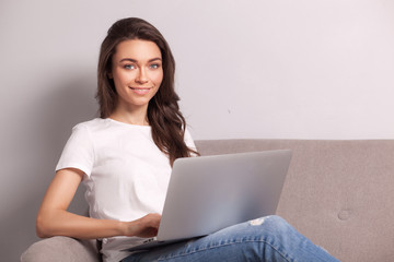 woman working on a laptop at home.