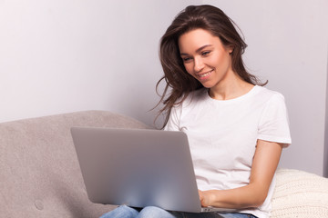 woman working on a laptop at home.