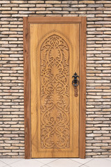 old wooden door on brick wall background texture