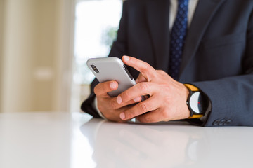 Close up of business man hands using smarpthone