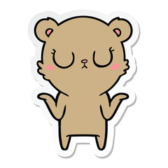 sticker of a peaceful cartoon bear shrugging
