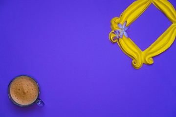 Purple background yellow frame notebook pen coffee mug globe flower flat lay instant photography camera keyboard computer 