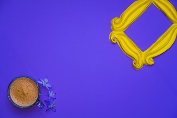 Purple background yellow frame notebook pen coffee mug globe flower flat lay instant photography camera keyboard computer 