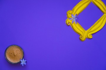 Purple background yellow frame notebook pen coffee mug globe flower flat lay instant photography camera keyboard computer 