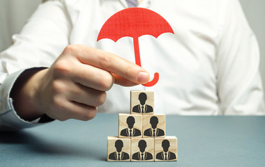 Boss holding a red umbrella and defending his team with a gesture of protection. Security and...