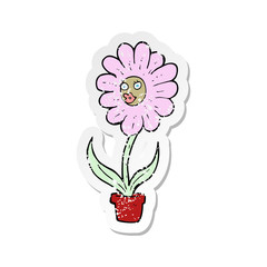 retro distressed sticker of a cartoon flower
