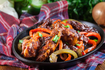 Chinese chicken wings with vegetables in sweet and sour sauce