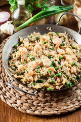 Fried rice with shrimp and vegetables on a frying pan