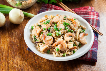Fried rice with shrimp and vegetables served on a plate