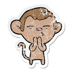 distressed sticker of a cartoon suspicious monkey
