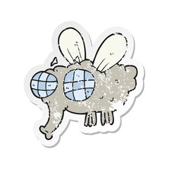 retro distressed sticker of a cartoon fly