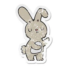 distressed sticker of a cute cartoon rabbit