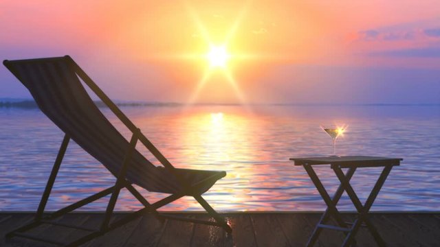 Deck chair and table with a glass of wine at lake coast is a very nice quiet place for chill out and leisure