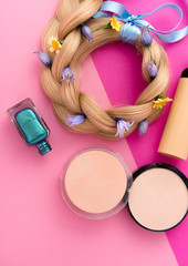 still life with make up products on pink