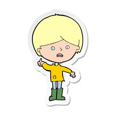 sticker of a cartoon unhappy boy