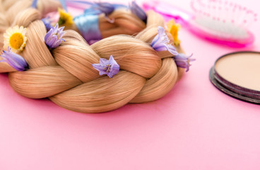 still life with make up products on pink