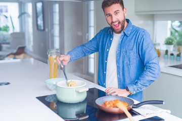Handsome man cooking pasta at home