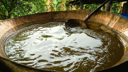 Large tacho of boiling molasses the main ingredient of the rapadura