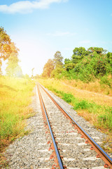 Railway - railroad tracks steel for trains in countryside on nature summer background