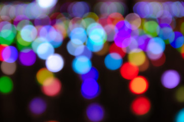 Colorful blur bokeh fairy street light festival, night defocused & dark background.