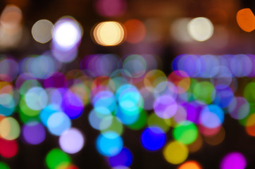 Obraz premium Colorful blur bokeh fairy street light festival, night defocused & dark background.