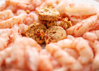 Herb and chill butter with prawns. Cooking sea food, close up, 