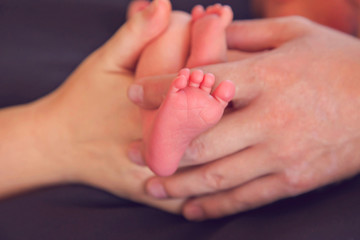 baby newborn premature with hands and feet parents caring loving