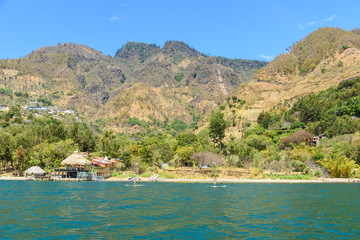 Fototapeta na wymiar Shore of Santa Cruz la Laguna at Lake Atitlan in vulcano landscape of Guatemala