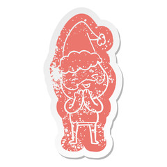 cartoon distressed sticker of a happy bearded man wearing santa hat