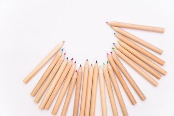 set of colored pencils on a white background