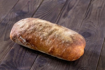 Rustic homemade bread on a wooden background