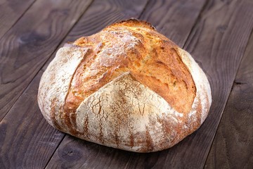 Rustic homemade bread on a wooden background