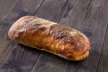 Rustic homemade bread on a wooden background