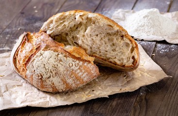 Rustic homemade bread on a wooden background